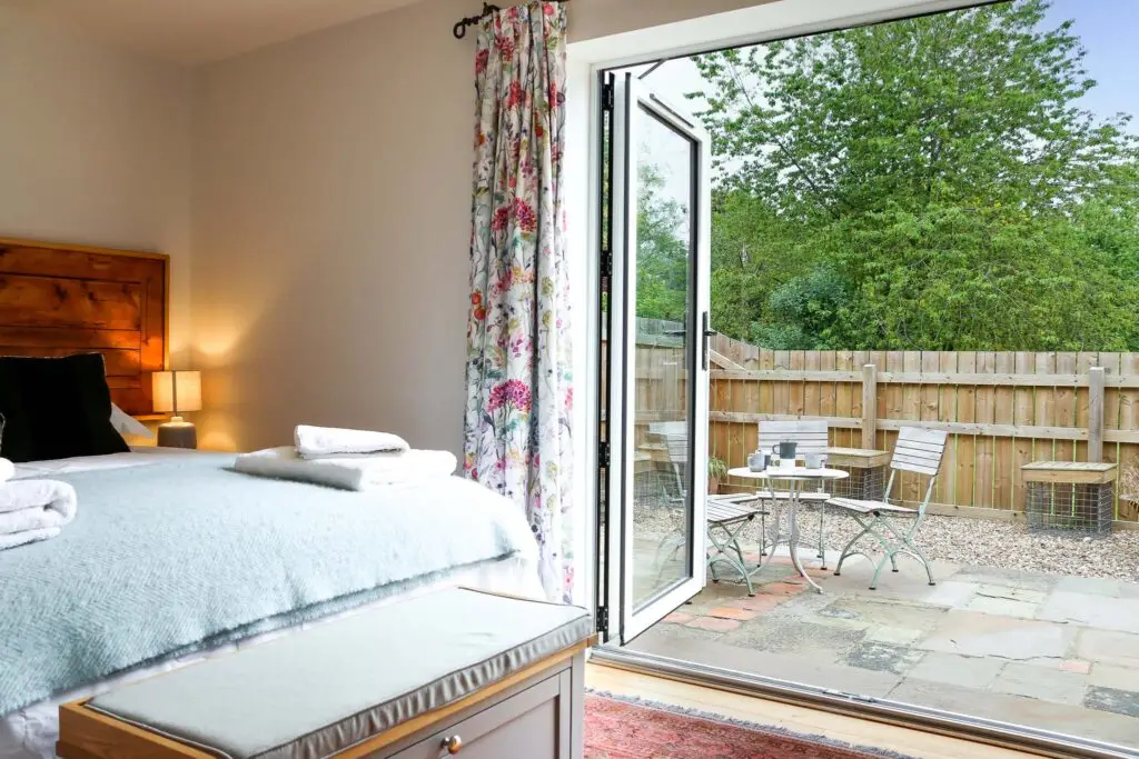 The bedroom looks on to the patio, where you can enjoy your morning coffee!